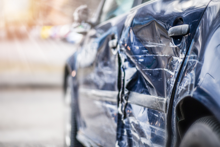 an accident. Black sedan with a smashed side